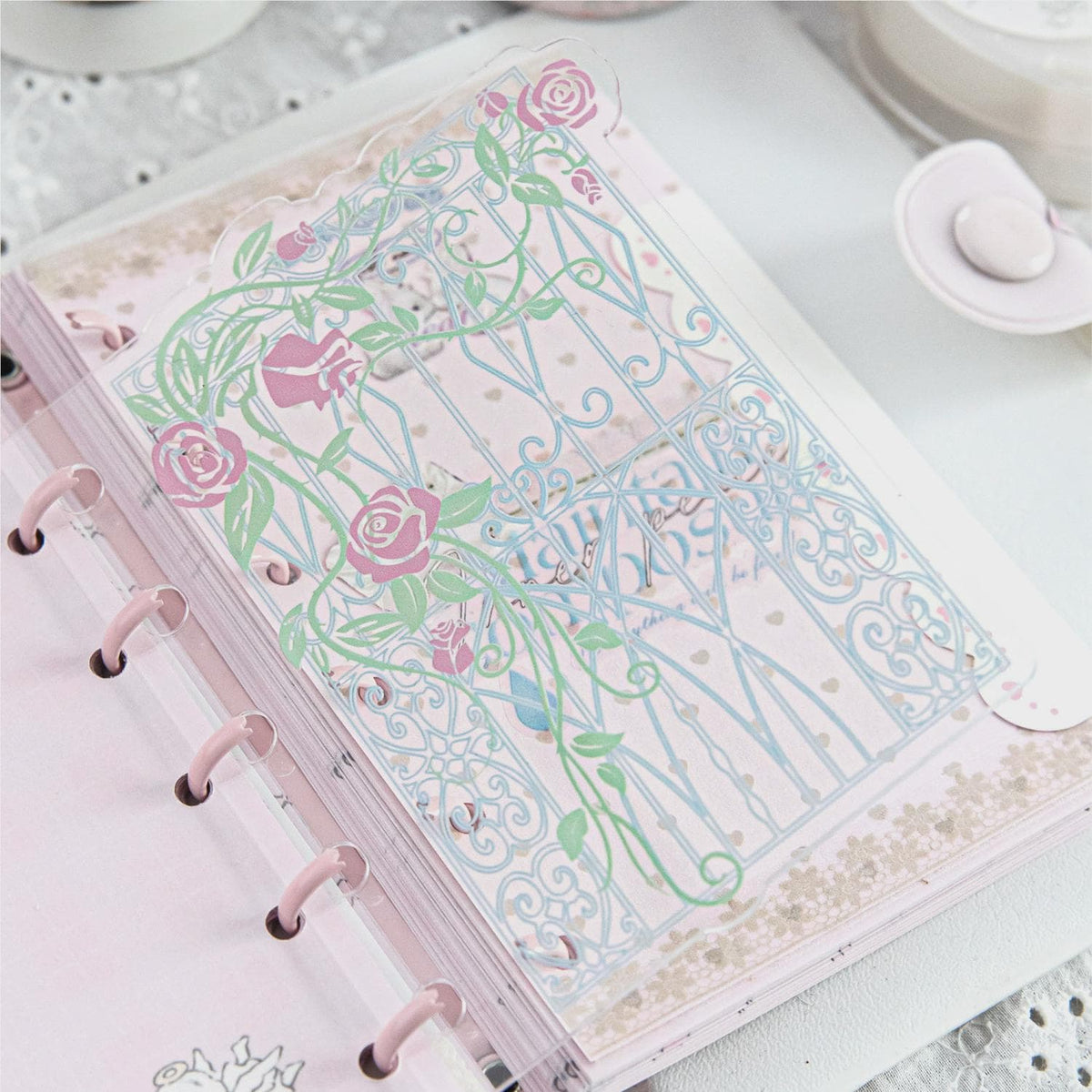 Acrylic rococo window divider in a ring planner